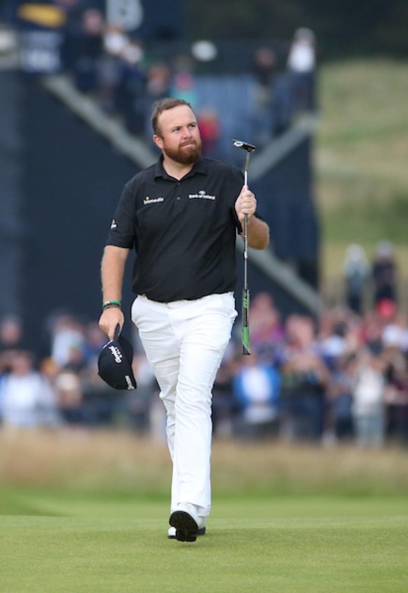 Shane Lowry, the toast of the Irish isle through 3 rounds of the British Open, salutes the fans Saturday at Royal Portrush.