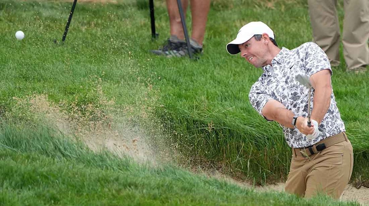 Rory McIlroy hits from a bunker in the first round of the 2022 U.S. Open.