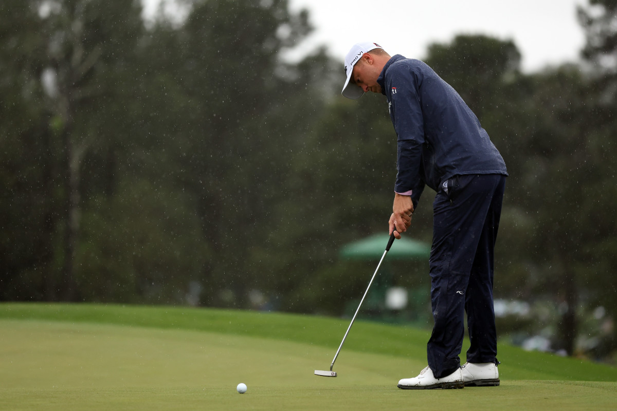Justin Thomas of the United States putts on the 18th green during the continuation of the weather delayed second round of the 2023 Masters Tournament at Augusta National Golf Club on April 08, 2023 in Augusta, Georgia.