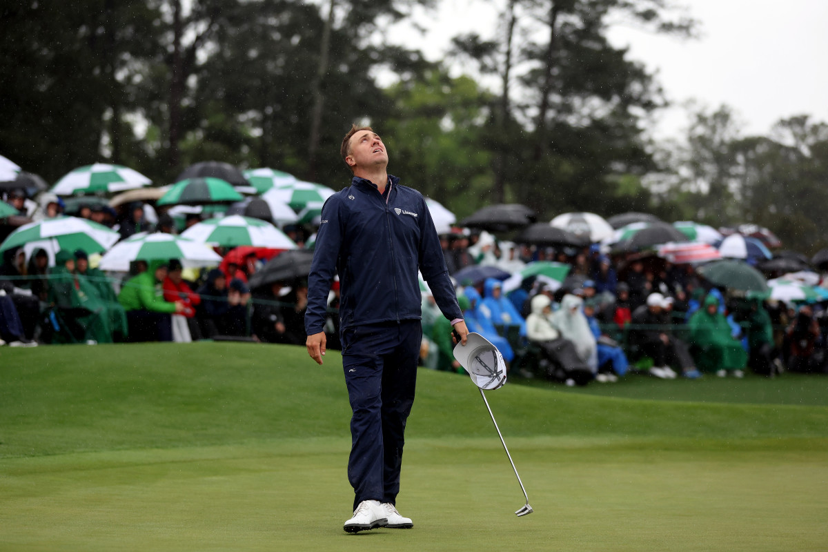 Justin Thomas of the United States reacts to his bogey on the 18th green during the continuation of the weather delayed second round of the 2023 Masters Tournament at Augusta National Golf Club on April 08, 2023 in Augusta, Georgia.