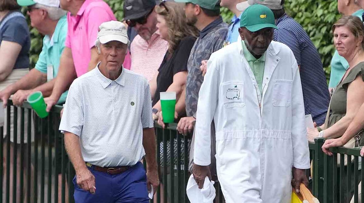 Ben Crenshaw and caddie Carl Jackson walk during the 2023 Masters Par 3 Contest.
