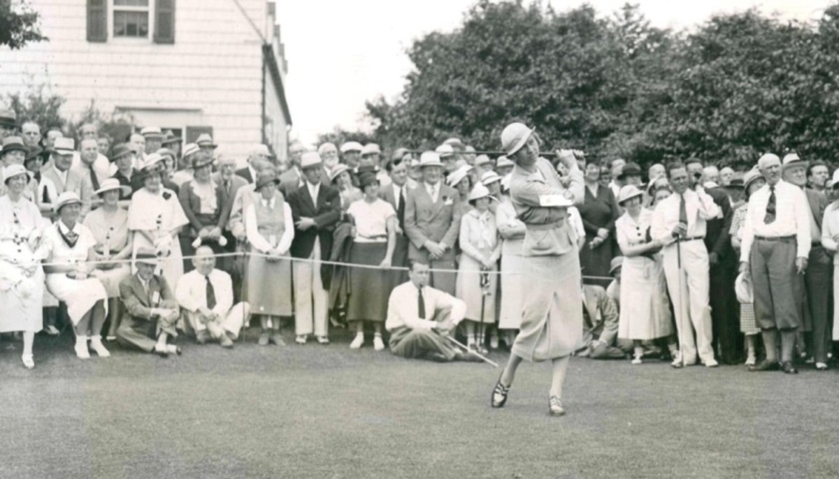 Joyce Wethered, who made a tour of North America in 1935, draws a crowd during an exhibition match on Long Island. 