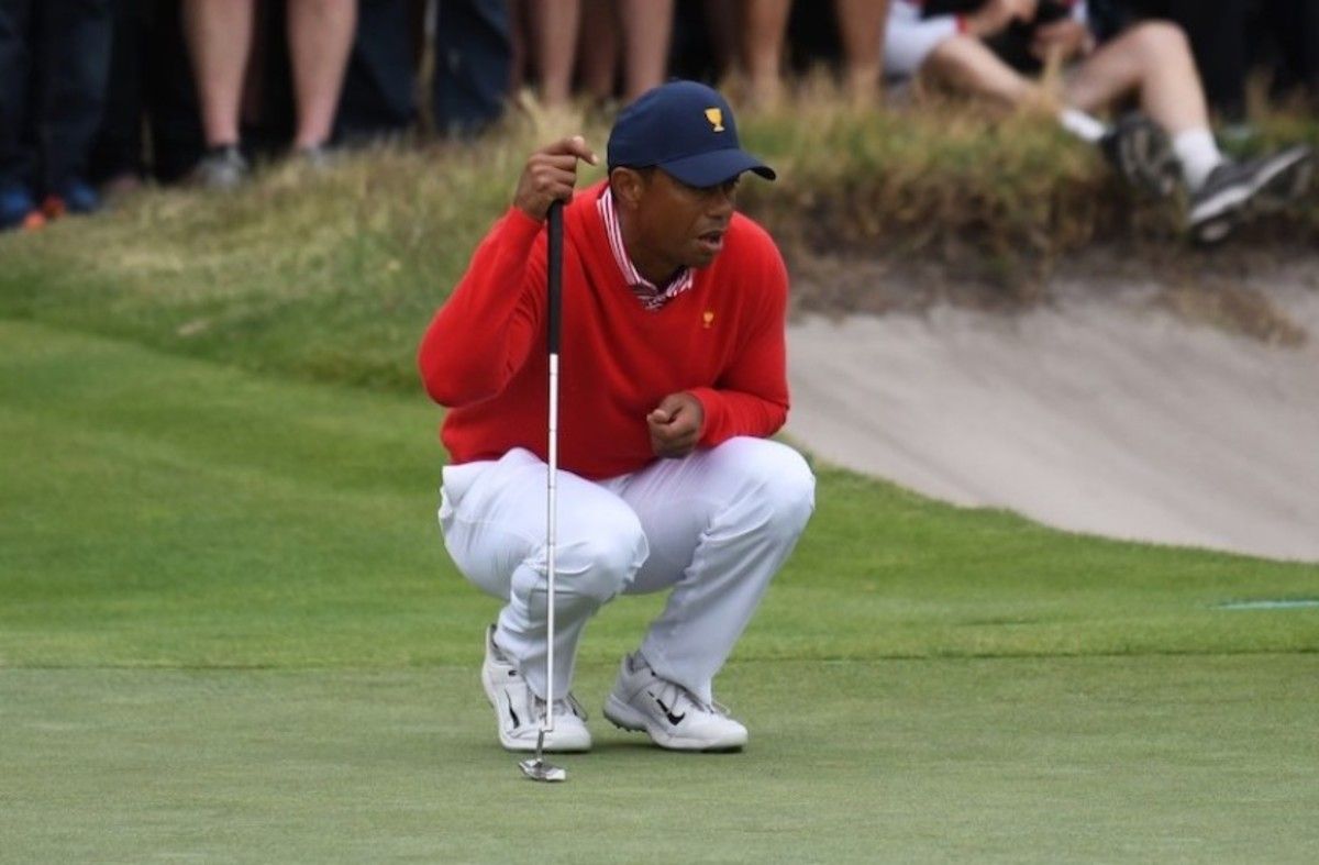 Tiger Woods, with help from partner Justin Thomas, delivers the lone point for the Americans in the opening session of the Presidents Cup at Royal Melbourne.