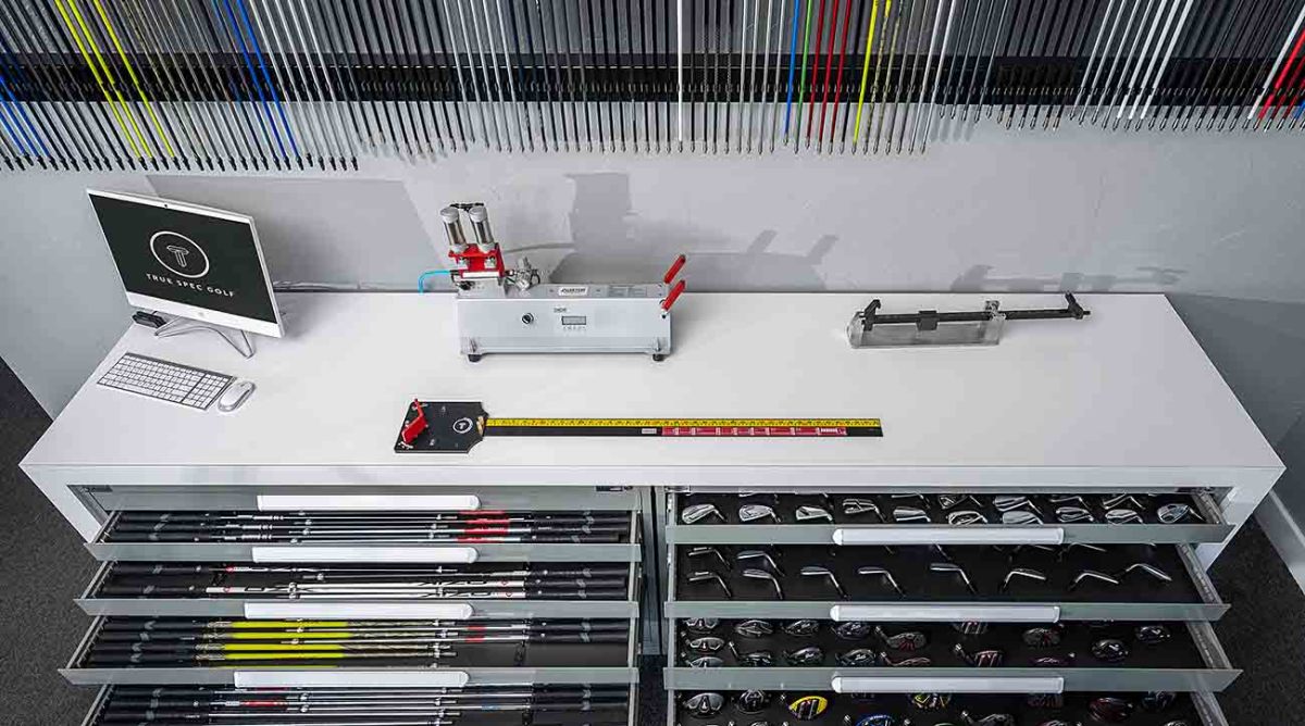A table with clubmaking components at True Spec Golf.