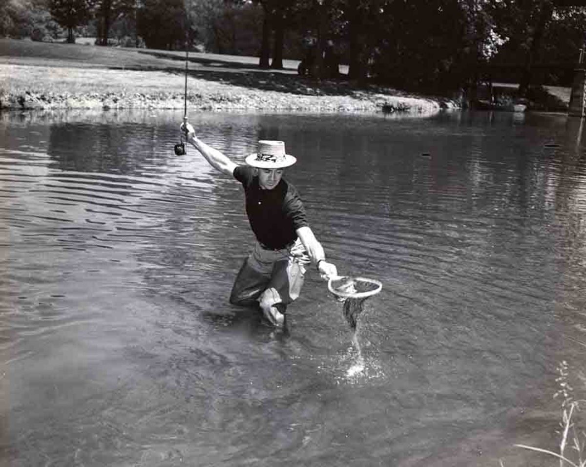 Hall of Fame golfer Sam Snead catches a fish at The Greenbrier.