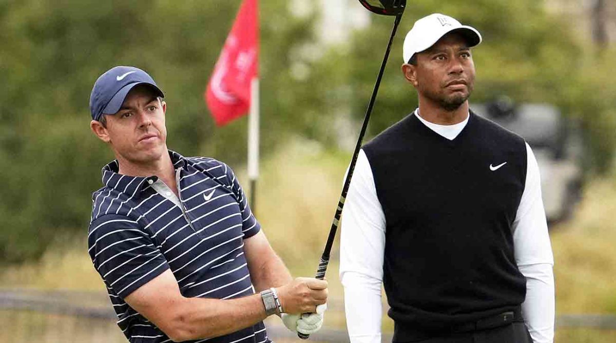Rory McIlroy and Tiger Woods during the R&A Celebration of Champions four-hole challenge at the 2022 British Open at St. Andrews Old Course.