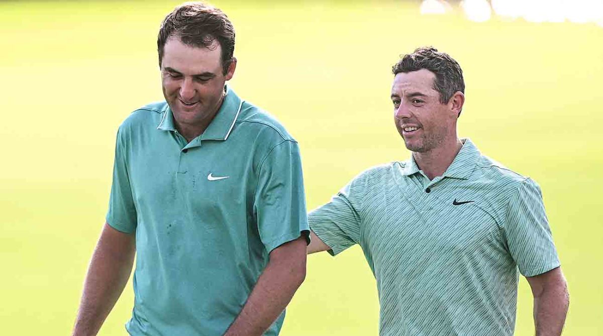 Scottie Scheffler (left) and Rory McIlroy are pictured at the 2022 Tour Championship.