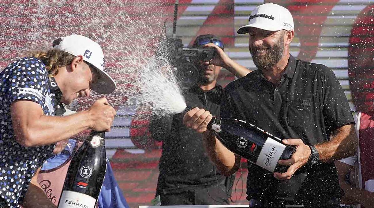 Dustin Johnson sprays champagne at the 2022 LIV Golf Team Championship in Doral, Florida.