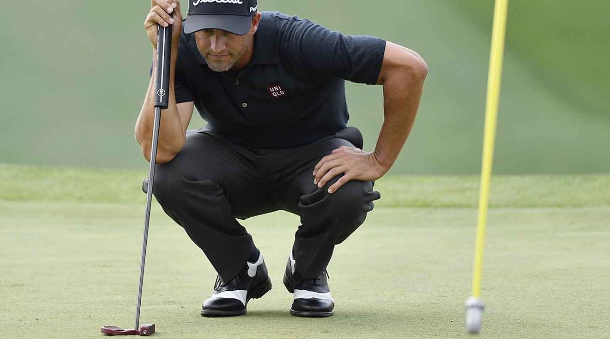Adam Scott lines up a putt at the 2019 Masters.