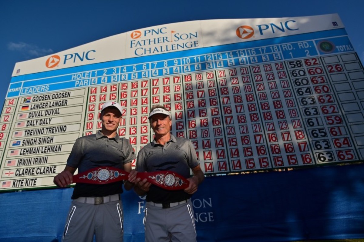 Jason Langer (left) and father Bernhard model their newest fashion accessories after winning the PNC Father-Son Challenge title Sunday at Ritz-Carlton Golf Club in Orlando, Fla.