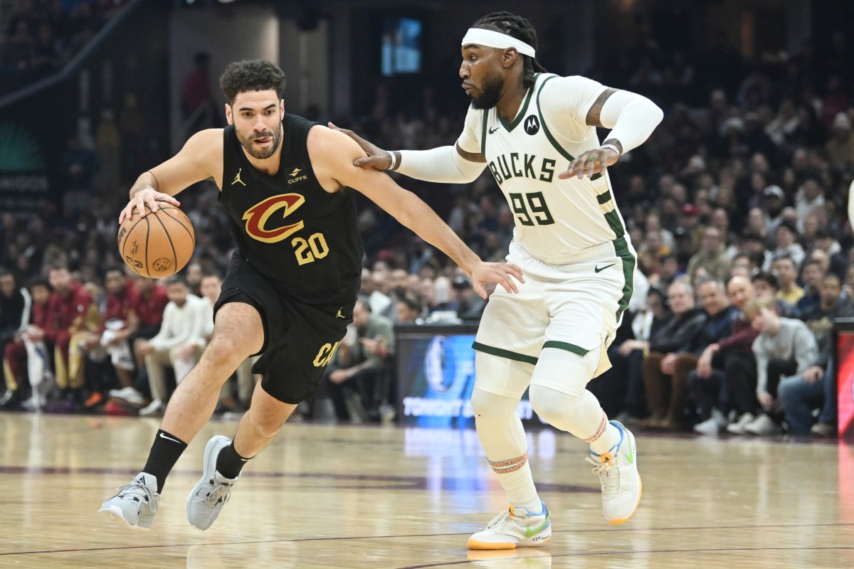Cleveland Cavaliers forward Georges Niang (20) drives to the basket against Milwaukee Bucks forward Jae Crowder (99) 