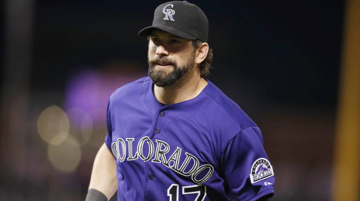 Colorado Rockies legend Todd Helton looks on while playing in a game.