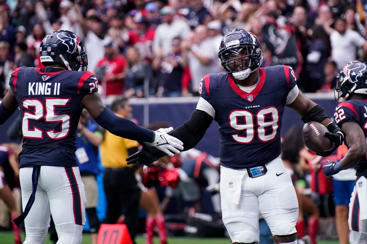 Houston Texans defensive tackle Sheldon Rankins (98) celebrates his touchdown off a ball fumbled by Tennessee Titans quarterback Will Levis during the second quarter at NRG Stadium in Houston, Texas., Sunday, Dec. 31, 2023