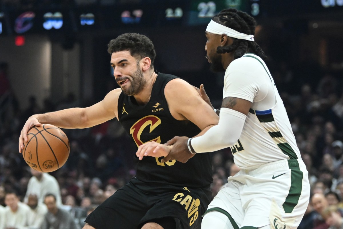 Cleveland Cavaliers forward Georges Niang (20) drives to the basket against Milwaukee Bucks forward Jae Crowder (99)