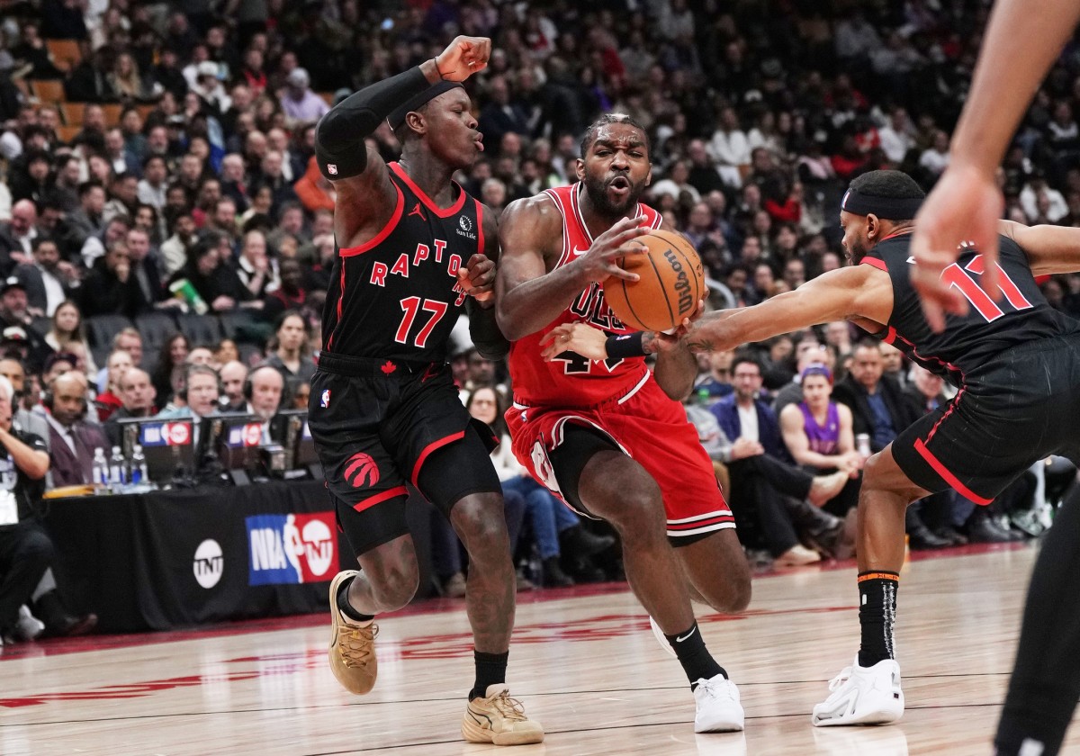 Chicago Bulls forward Patrick Williams (44) controls the ball between Toronto Raptors guard Dennis Schroder (17) and guard Bruce Brown (11) during the third quarter at Scotiabank Arena
