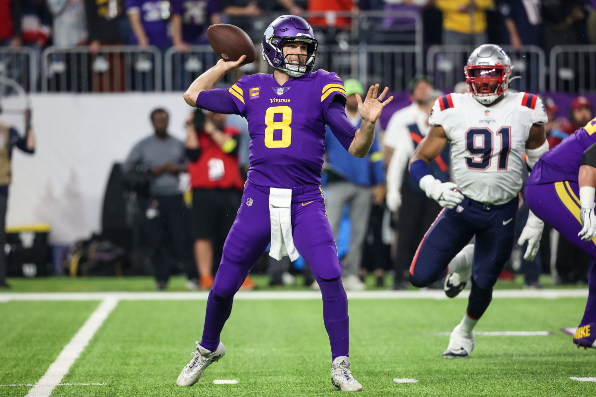 Nov 24, 2022; Minneapolis, Minnesota, USA; Minnesota Vikings quarterback Kirk Cousins (8) throws the ball against the New England Patriots during the first quarter at U.S. Bank Stadium.