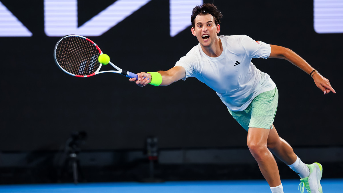 Dominic Thiem of Austria plays a shot against Felix Auger Aliassime.