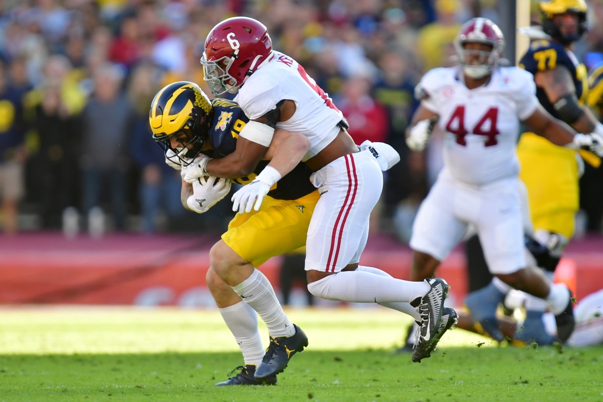 Jan 1, 2024; Pasadena, CA, USA; Michigan Wolverines tight end Colston Loveland (18) makes a catch against Alabama Crimson Tide defensive back Jaylen Key (6) in the second quarter in the 2024 Rose Bowl college football playoff semifinal game at Rose Bowl. Mandatory Credit: Gary A. Vasquez-USA TODAY Sports  