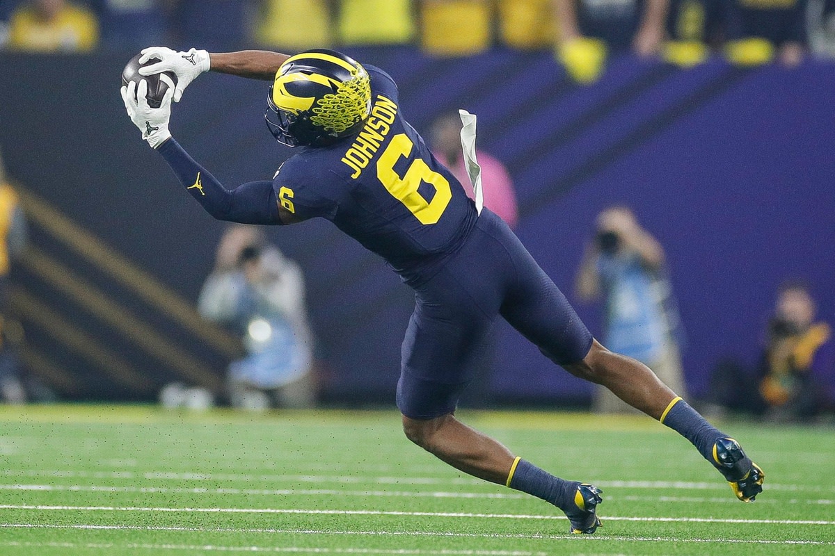 Michigan wide receiver Cornelius Johnson makes a catch against Washington during the first half of the national championship game at NRG Stadium in Houston, Texas on Monday, Jan. 8, 2024.  