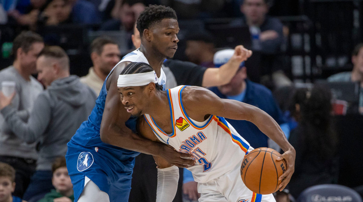 Oklahoma City Thunder guard Shai Gilgeous-Alexander drives with the ball against Minnesota Timberwolves guard Anthony Edwards on Jan. 20, 2024.