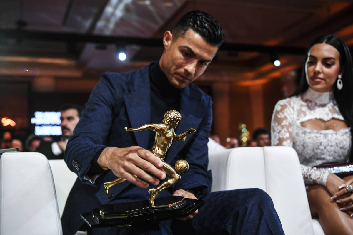 Cristiano Ronaldo pictured holding his trophy for the Maradona Award after being presented with it by Globe Soccer in January 2024