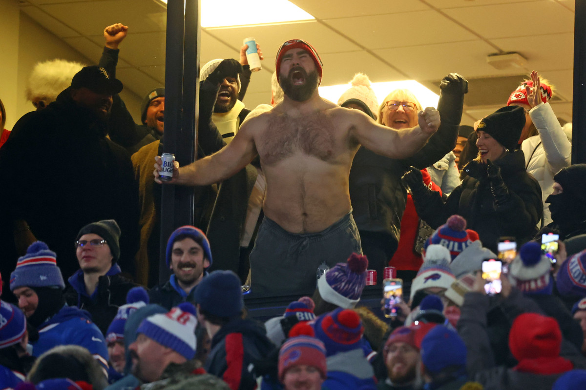 Philadelphia Eagles center Jason Kelce, shirtless and chugging beer, cheers on brother Travis Kelce and the Kansas City Chiefs.