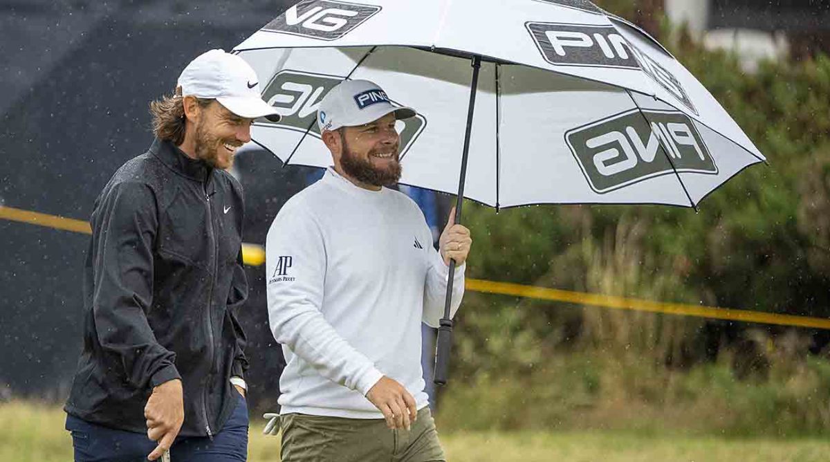 Tommy Fleetwood (left) and Tyrrell Hatton talk on the fourth hole during a practice round at the 2023 British Open.
