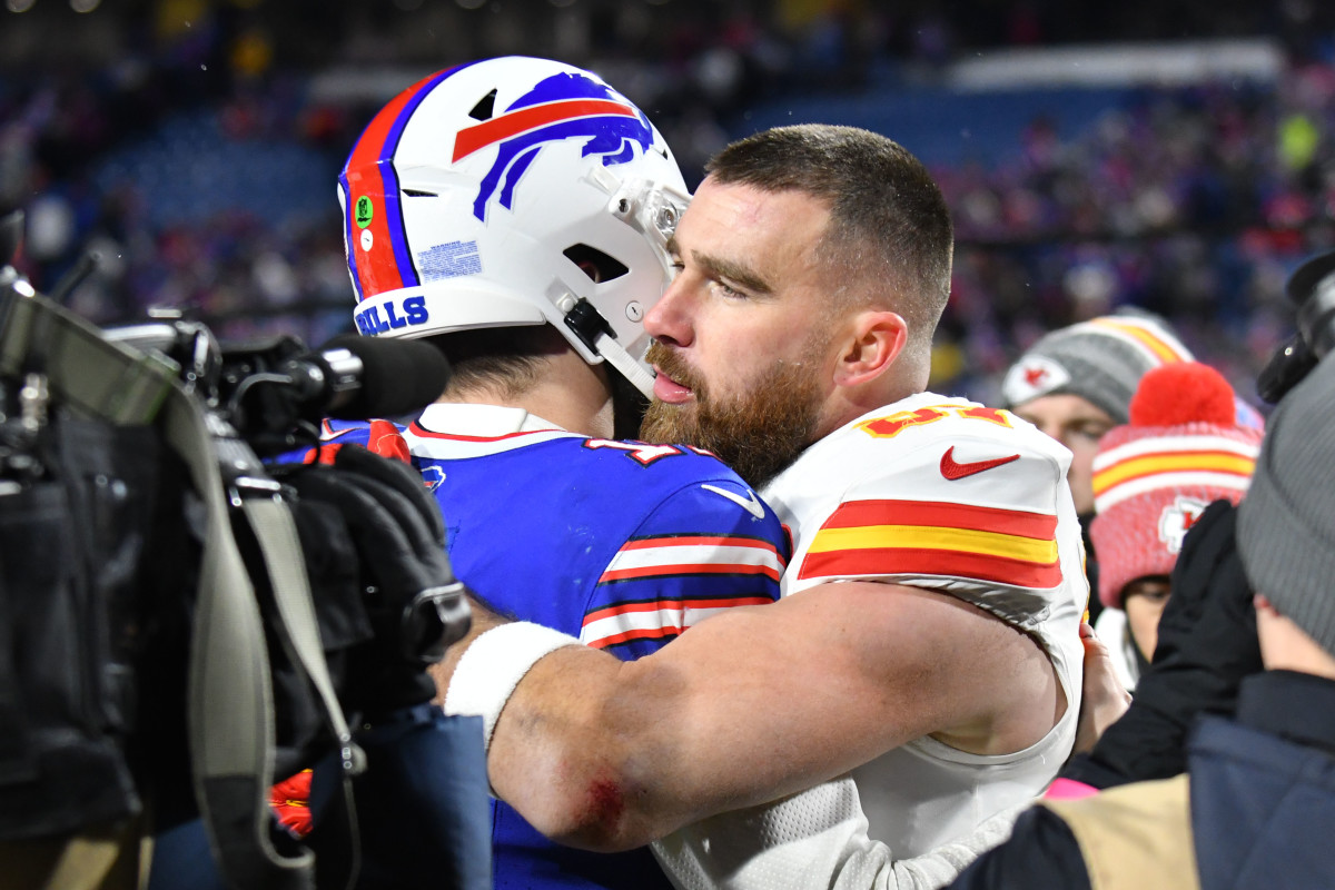 Jan 21, 2024; Orchard Park, New York, USA; Kansas City Chiefs tight end Travis Kelce (87) reacts with Buffalo Bills quarterback Josh Allen (17) after the 2024 AFC divisional round game at Highmark Stadium. 