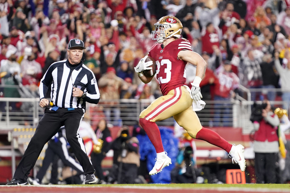 January 20, 2024; Santa Clara, CA, USA; San Francisco 49ers running back Christian McCaffrey (23) runs to score a touchdown against the Green Bay Packers during the third quarter in a 2024 NFC divisional round game at Levi's Stadium. Mandatory Credit: Kyle Terada-USA TODAY Sports