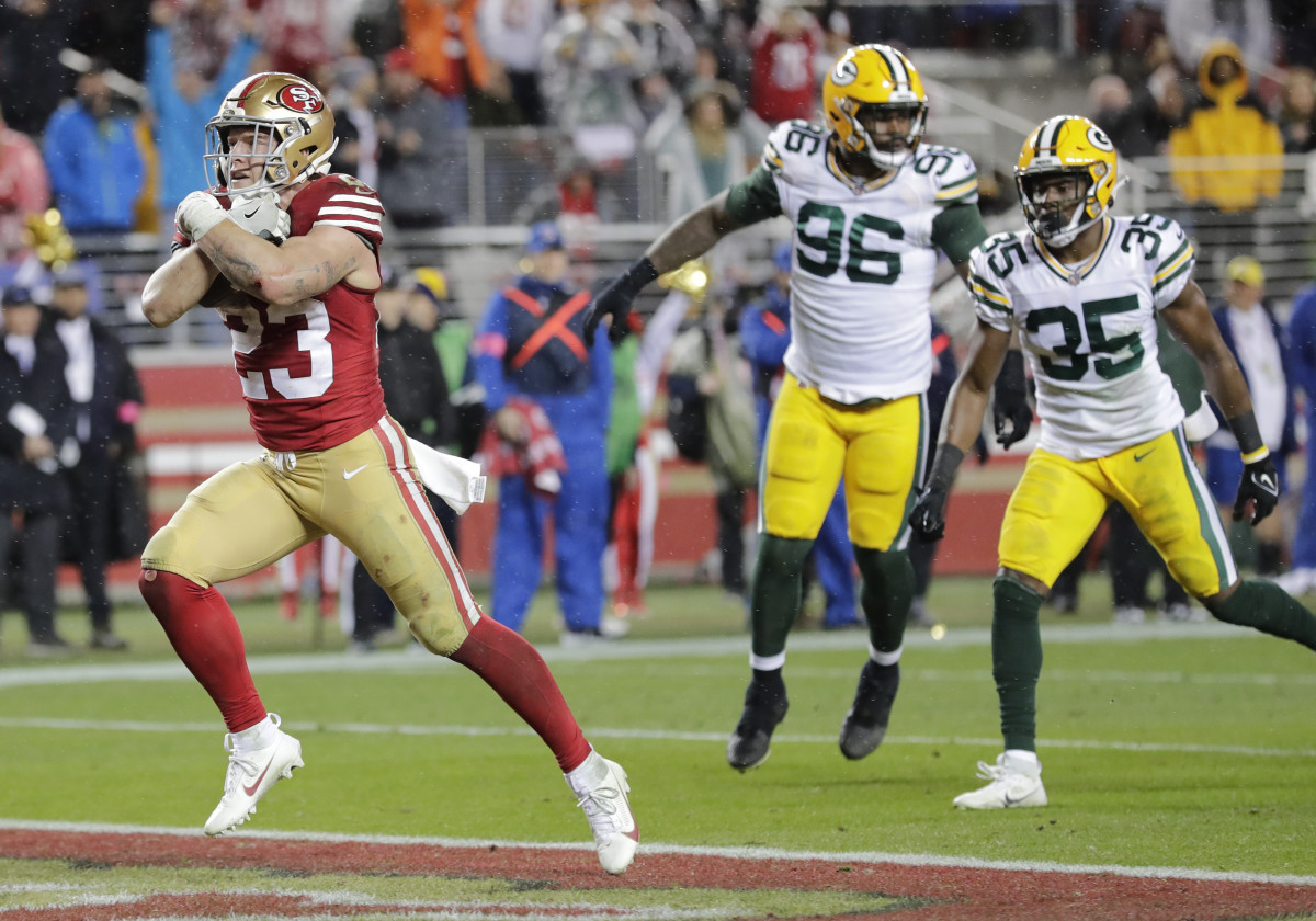 Jan 20, 2024; Santa Clara, CA, USA; San Francisco 49ers running back Christian McCaffrey (23) crosses the goal line for the decisive touchdown late in the fourth quarter against the Green Bay Packers in a 2024 NFC divisional round game at Levi's Stadium. Mandatory Credit: Dan Powers-USA TODAY Sports