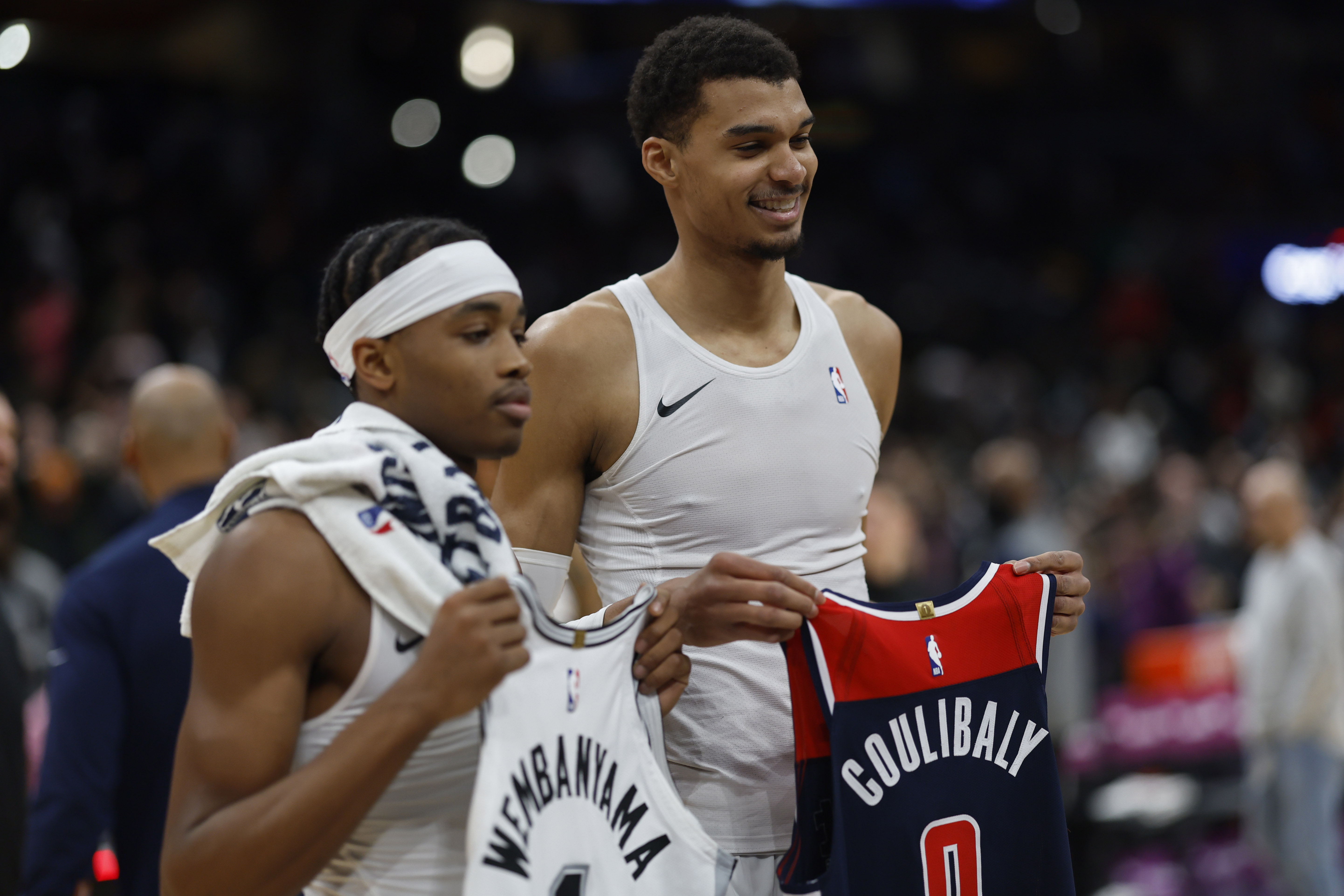 Jan 20, 2024; Washington, District of Columbia, USA; Washington Wizards guard Bilal Coulibaly (L) and San Antonio Spurs center Victor Wembanyama (R) swap jerseys after their game at Capital One Arena.