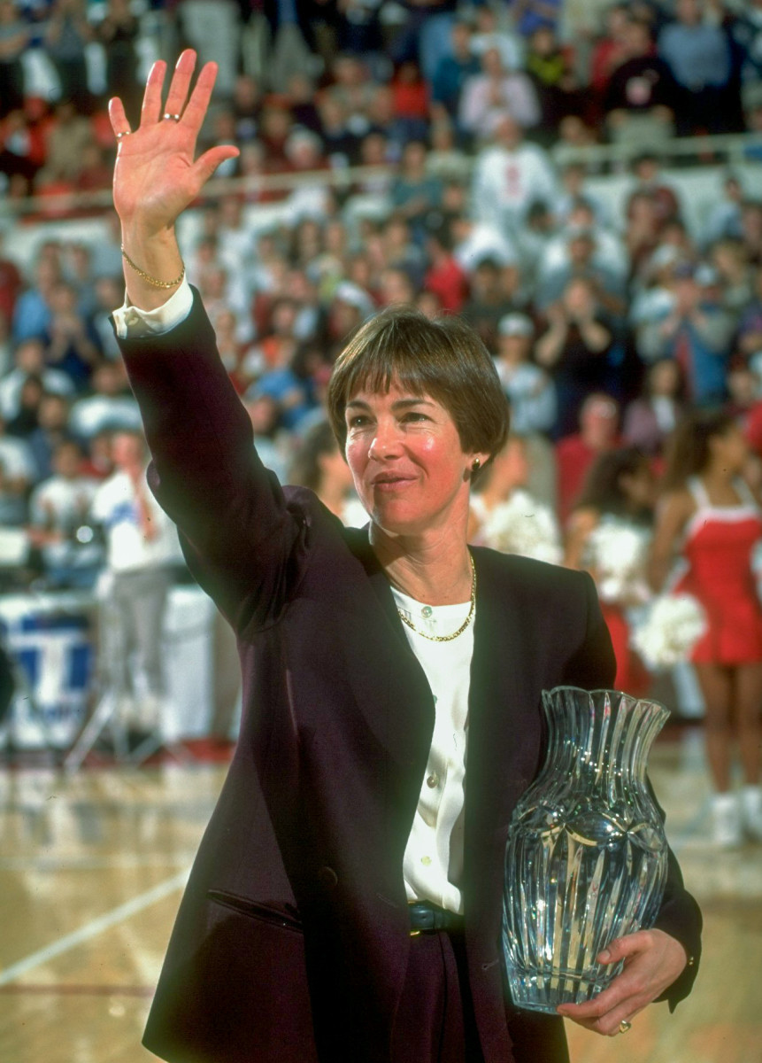 Portrait of Stanford coach Tara Vanderveer alone, victorious & holding vase after game vs Alabama in 1999.