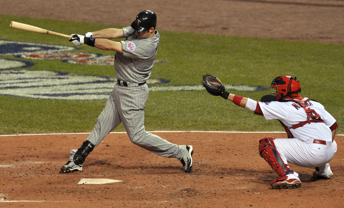 July 14, 2009; St. Louis, MO, USA; American League catcher Joe Mauer of the Minnesota Twins hits an RBI double during the fifth inning of the 2009 All-Star Game at Busch Stadium.