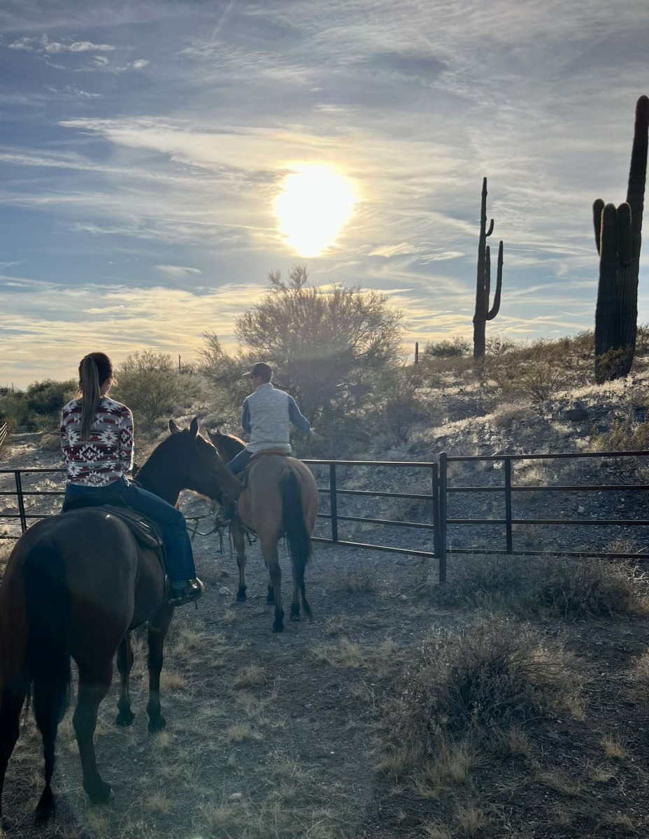 Abbey Lowe (Cooper) and her boyfriend riding horses in Arizona.