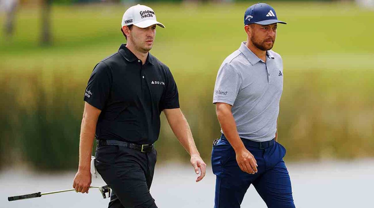 Patrick Cantlay and Xander Schauffele walk during the 2023 Zurich Classic of New Orleans.