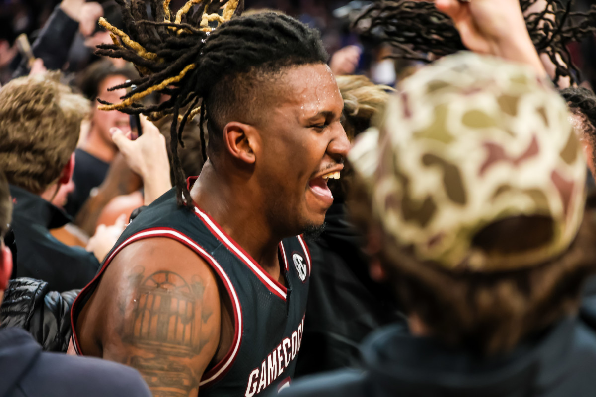 Gamecock forward BJ Mack celebrating with South Carolina fans storming the court after upset win over No. 6 Kentucky (23rd Jan., 2024)