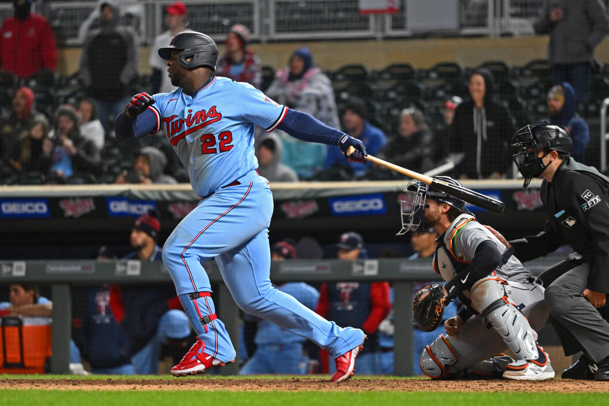 Apr 26, 2022; Minneapolis, Minnesota, USA; Minnesota Twins first baseman Miguel Sano (22) hits a single in the ninth inning against the Detroit Tigers at Target Field.