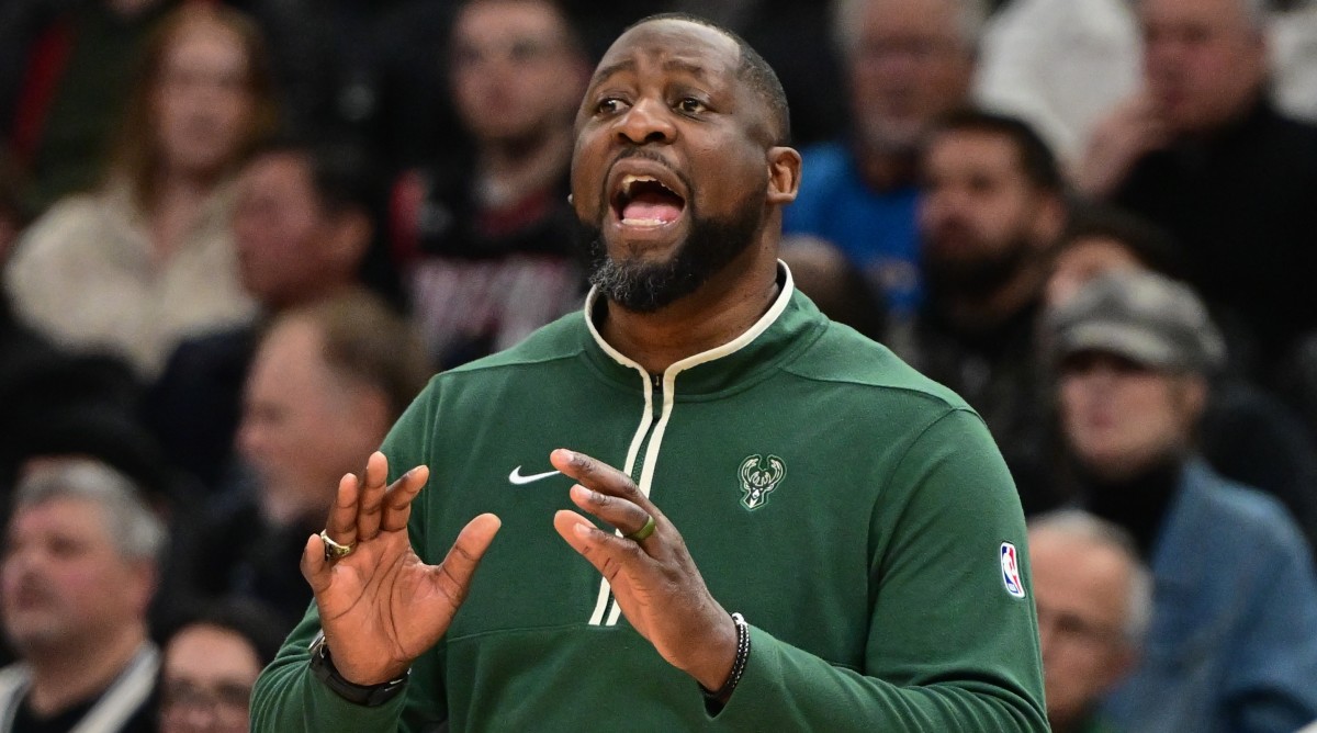 Milwaukee Bucks head coach Adrian Griffin calls a play in the first quarter of a game against the Indiana Pacers.