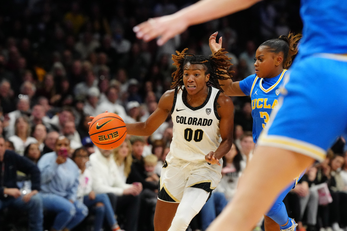 Jan 19, 2024; Boulder, Colorado, USA; Colorado Buffaloes guard Jaylyn Sherrod (00 controls the ball past UCLA Bruins guard Londynn Jones (3) in the second half at the CU Events Center