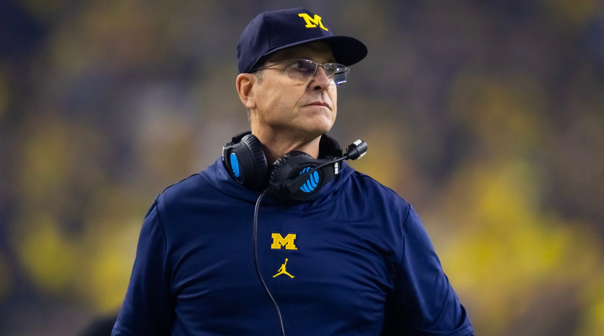 Michigan Wolverines head coach Jim Harbaugh looks on from the sideline against the Washington Huskies in the 2024 College Football Playoff national championship game.