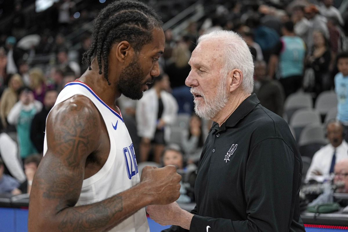 Nov 22, 2023; San Antonio, Texas, USA; San Antonio Spurs head coach Gregg Popovich talks with Los Angeles Clippers forward Kawhi Leonard (2) after a game at Frost Bank Center.