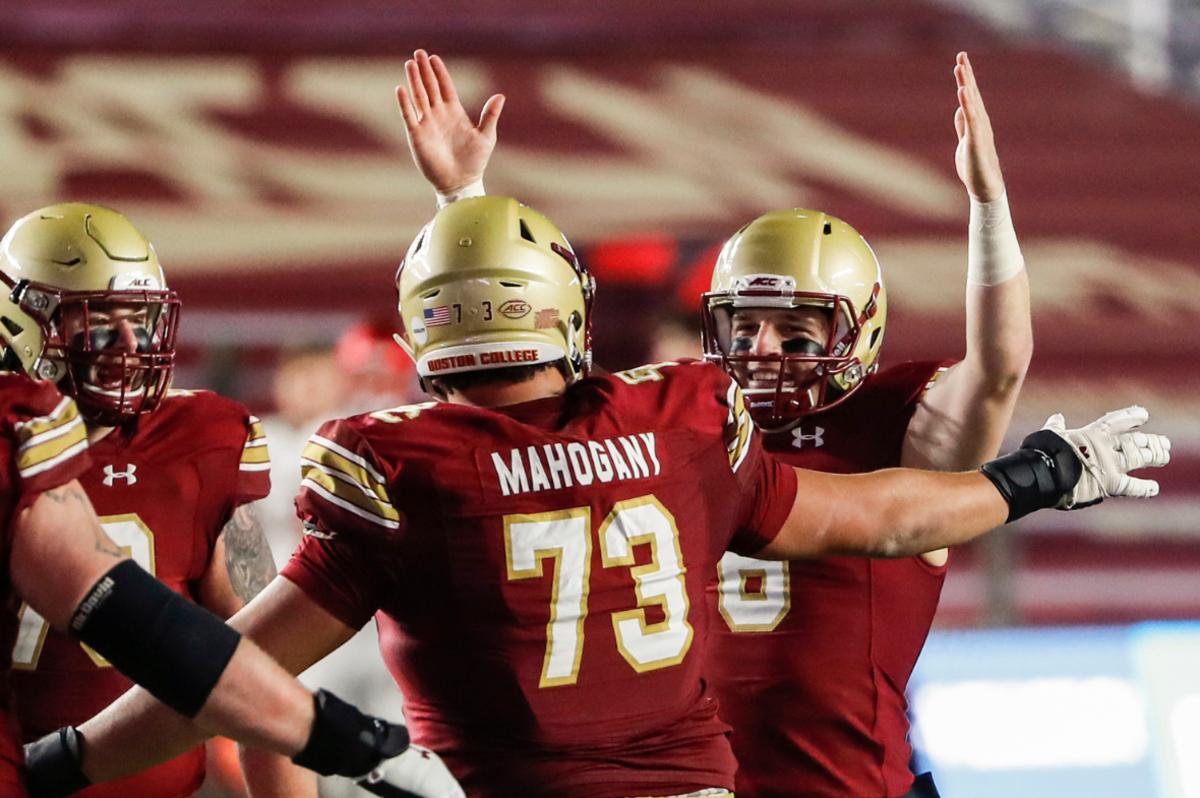 Boston College Eagles quarterback Dennis Grosel (6) celebrates a touchdown pass with offensive lineman Christian Mahogany (73) against the Louisville Cardinals during the second half at Alumni Stadium.