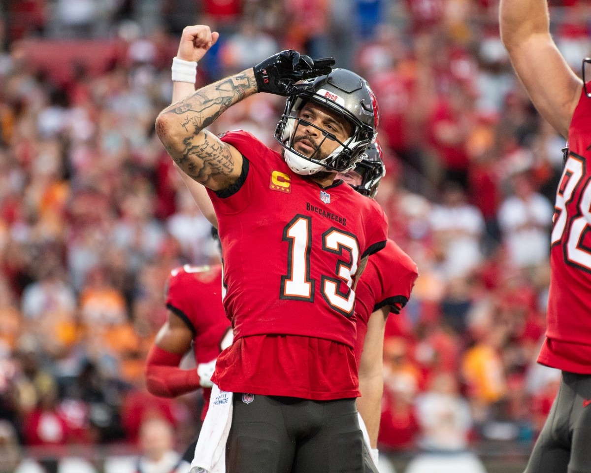 Dec 24, 2023; Tampa, Florida, USA; Tampa Bay Buccaneers wide receiver Mike Evans (13) celebrates the touchdown against the Jacksonville Jaguars in the second quarter at Raymond James Stadium.