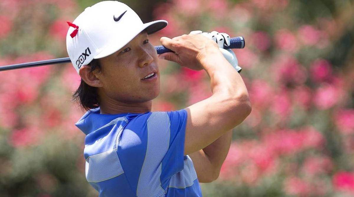 Golfer Anthony Kim looks on after hitting a ball in a torunament.