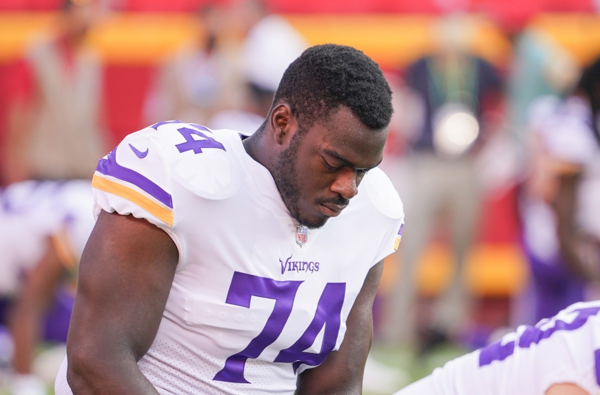 Aug 27, 2021; Kansas City, Missouri, USA; Minnesota Vikings offensive tackle Oli Udoh (74) stretches before the game against the Kansas City Chiefs at GEHA Field at Arrowhead Stadium.