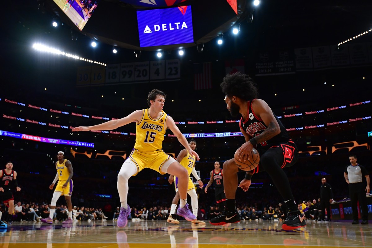 Chicago Bulls guard Coby White (0) moves the ball against Los Angeles Lakers guard Austin Reaves (15) during the second half at Crypto.com Arena. 