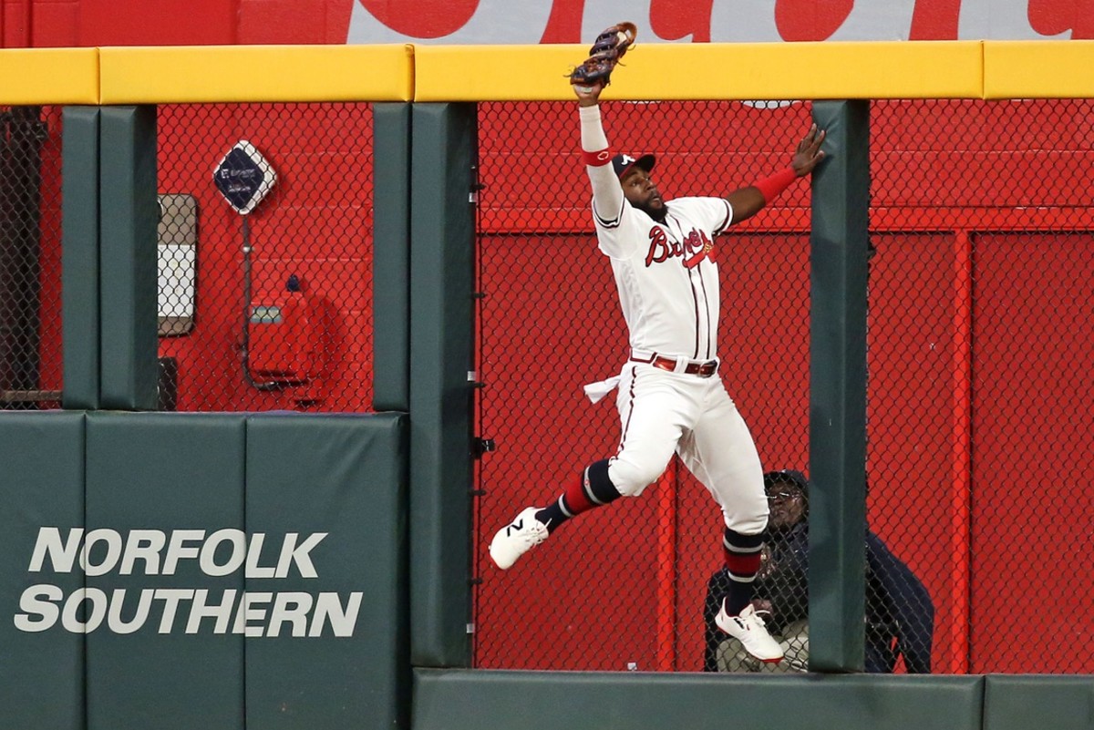 Oct 9, 2023; Cumberland, Georgia, USA; Atlanta Braves center fielder Michael Harris II (23) makes a catch at the wall for an out during the ninth inning against the Philadelphia Phillies in game two of the NLDS for the 2023 MLB playoffs at Truist Park.