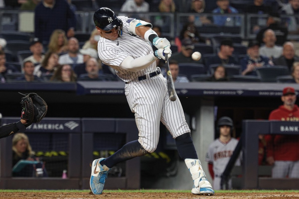 New York Yankees right fielder Aaron Judge (99) hits his third home run of the game during the seventh inning against the Arizona Diamondbacks at Yankee Stadium.