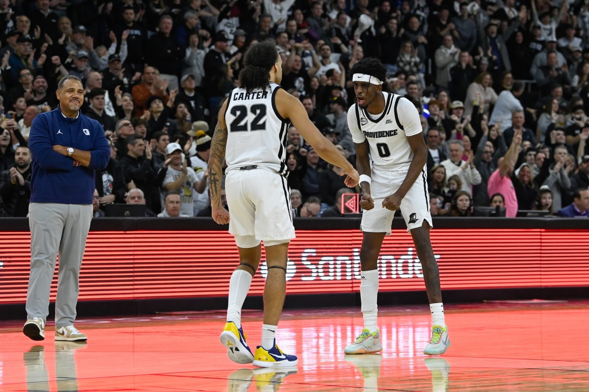 Georgetown coach Cooley (left) watches Providence players during a game at Amica Mutual Pavilion.