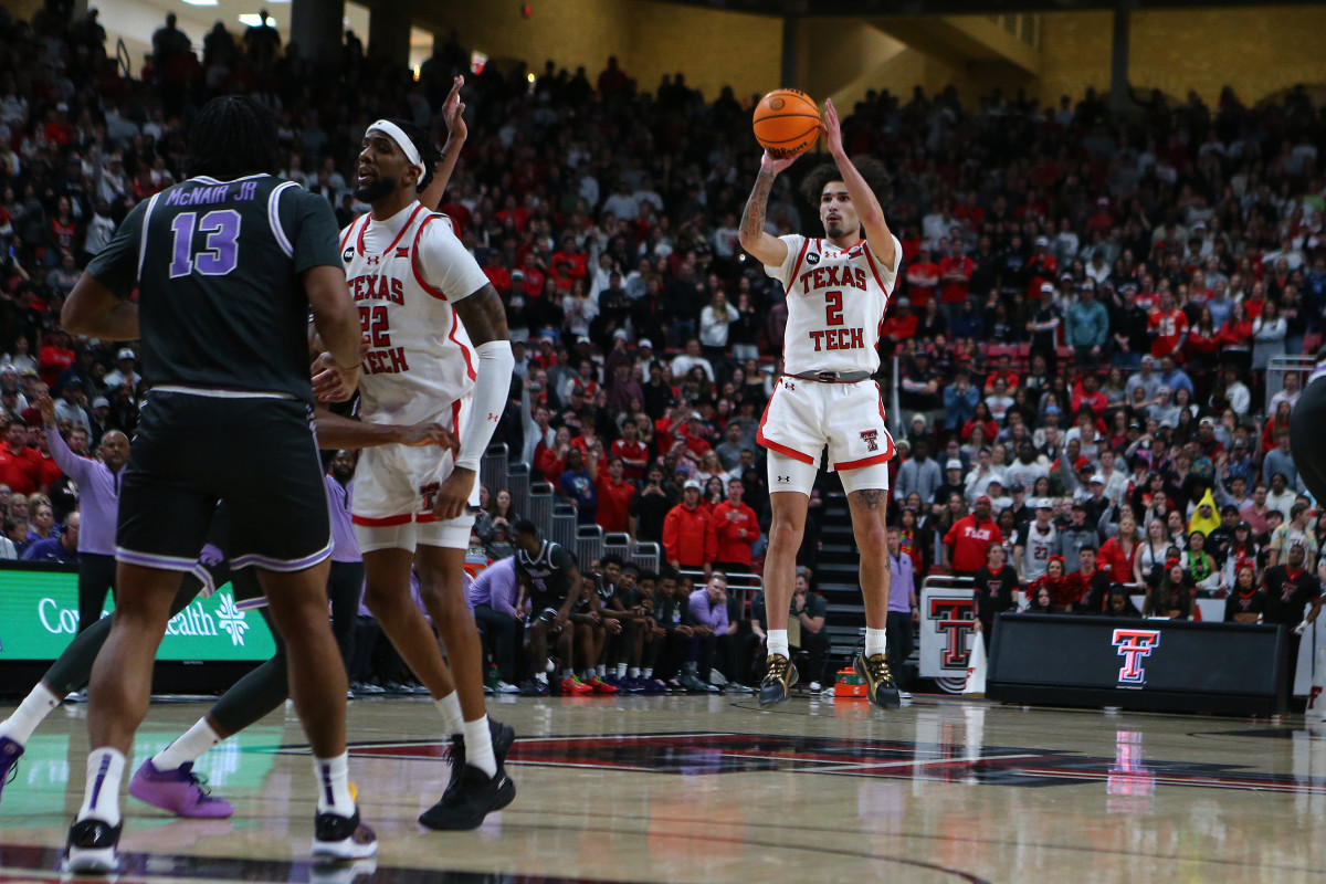 Jan 13, 2024; Lubbock, Texas, USA; Texas Tech Red Raiders guard Pop Isaacs (2) takes a jump shot against Kansas State Wildcats center Will McNair Jr. (13) in the second half at United Supermarkets Arena. Mandatory Credit: Michael C. Johnson-USA TODAY Sports